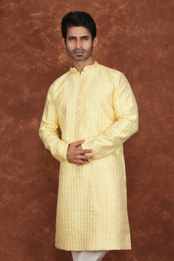 Men wearing pastel heritage jacquard kurta in vibrant yellow with embroidered neckline for wedding and festive wear