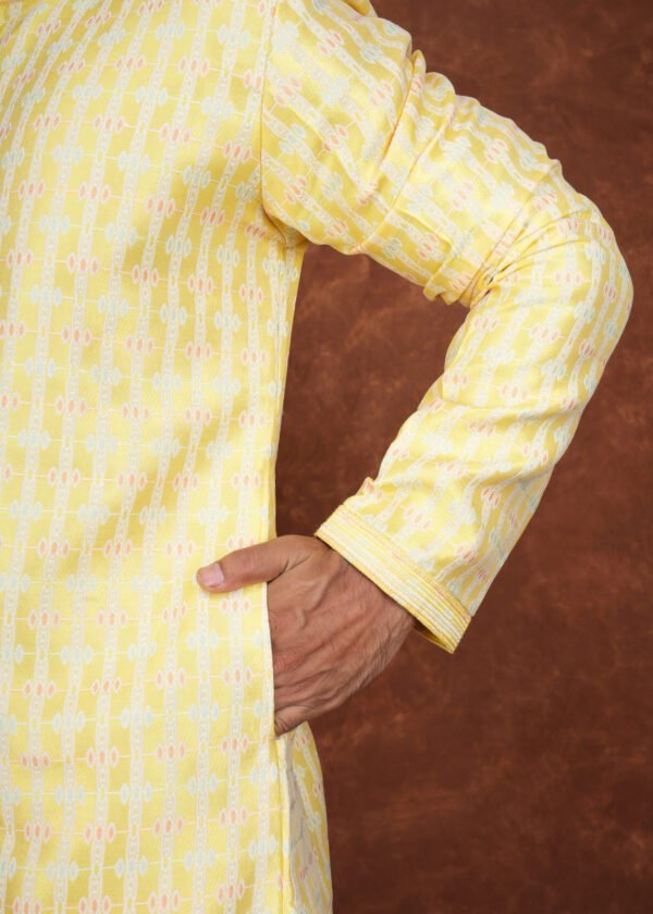 Men wearing pastel heritage jacquard kurta in vibrant yellow with embroidered neckline for wedding and festive wear