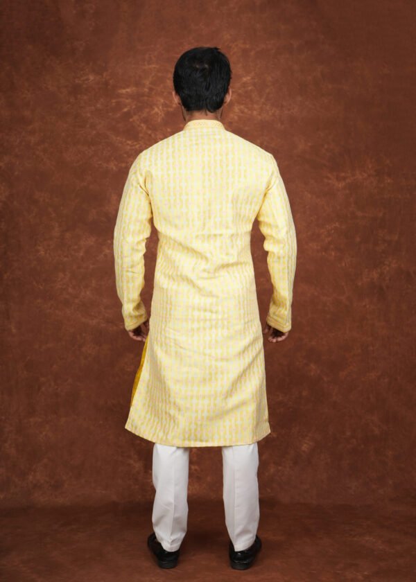 Men wearing pastel heritage jacquard kurta in vibrant yellow with embroidered neckline for wedding and festive wear
