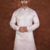 Men wearing classic diamond jacquard kurta in soft pink with mandarin collar for wedding and festive wear