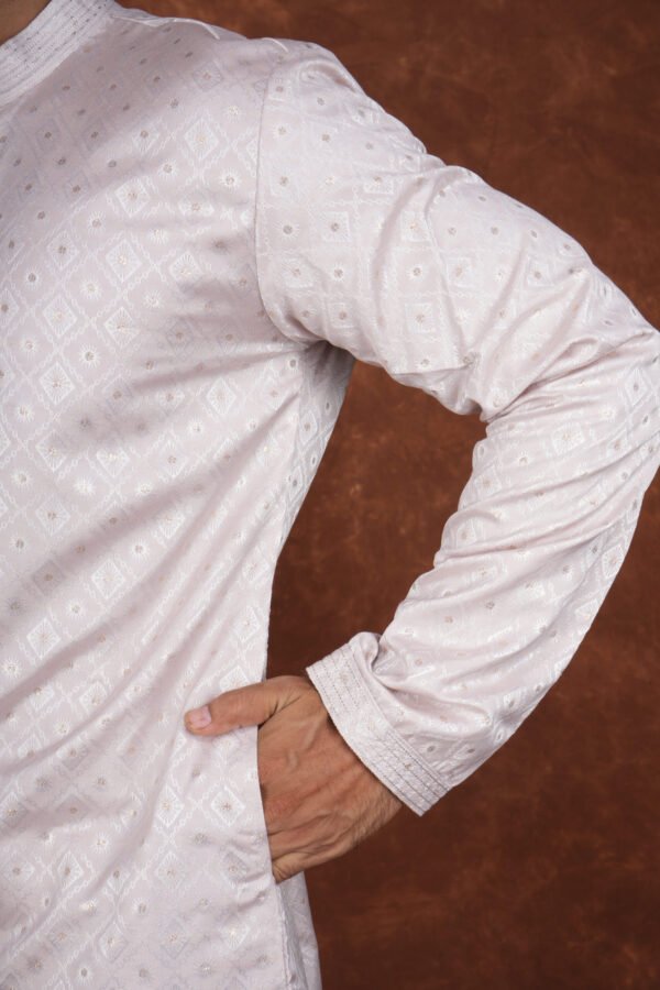 Men wearing classic diamond jacquard kurta in soft pink with mandarin collar for wedding and festive wear