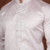 Men wearing classic diamond jacquard kurta in soft pink with mandarin collar for wedding and festive wear