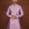 Men wearing royal weave jacquard kurta in mauve with mandarin collar for wedding and festive wear