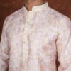 Men wearing pastel yellow mosaic jacquard kurta with mandarin collar for wedding and festive wear