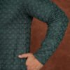 Men wearing royal green textured jacquard kurta with full sleeves and band collar for festive and traditional occasions