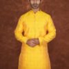 Men wearing suryakant jacquard kurta in vibrant yellow with mandarin collar for wedding and festive wear