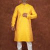 Men wearing suryakant jacquard kurta in vibrant yellow with mandarin collar for wedding and festive wear