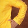 Men wearing suryakant jacquard kurta in vibrant yellow with mandarin collar for wedding and festive wear